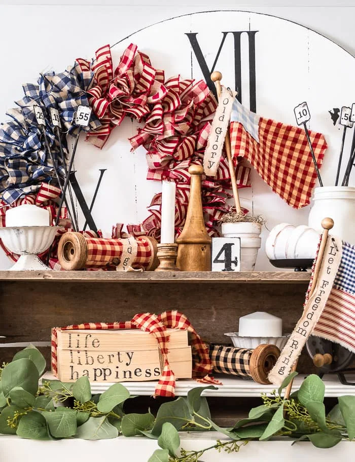 patriotic bookstack, wreath, flags, greenery