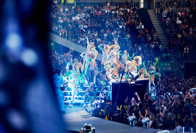 A shot of Beyoncé performing on the Renaissance World Tour. Beyoncé is surrounded by her dancers during the Queens Remix section of “Break My Soul”.