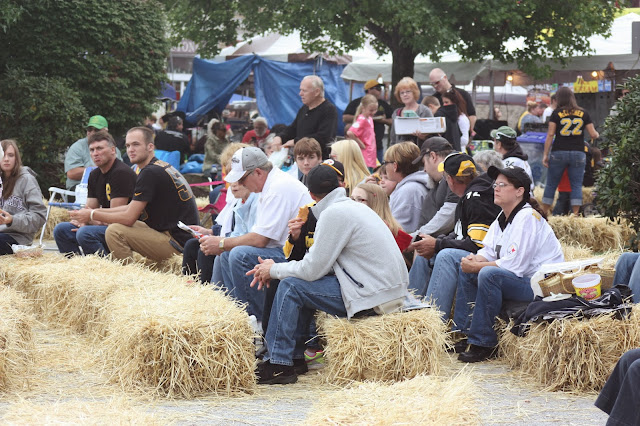 People chatting on hay bales