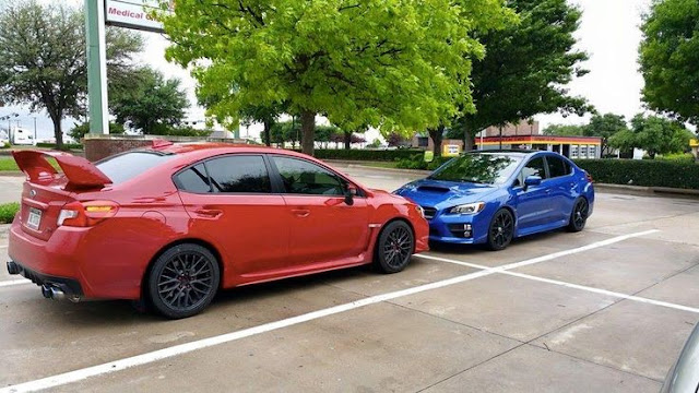 a Red Subaru WRX STi and a Blue Subaru WRX parked in front of one another. Custom Images Photos Latest Pics 2015 2016 2017 2018