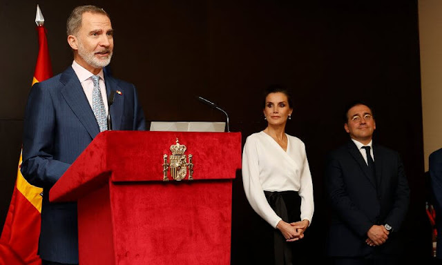 Queen Letizia wore white silk top and black skirt at the Epic Sana Hotel in Luanda for opening exhibition by Joan Miro