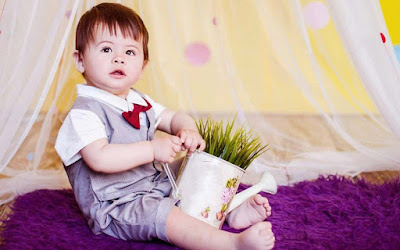 babyboy-playing-with-flower-water-pot