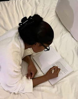 Woman writing end of the year prompts