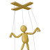 A doll tied with a string by a wood support - 6 Letters