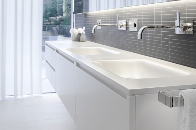 Modern white double sink in the bathroom 