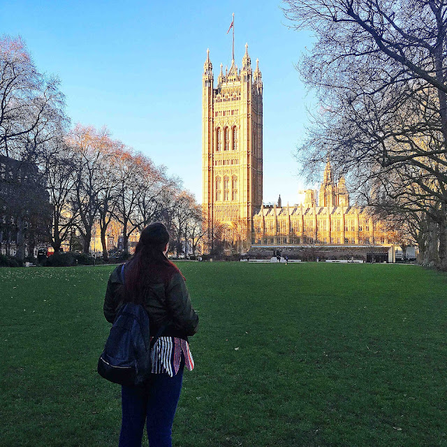 Plus size blogger by the houses of parliament in london