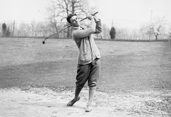 Golfer Johnny Farrell pictured swinging golf club in 1922