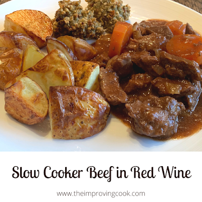 A plate with slow cooked beef, roast potatoes and stufffing