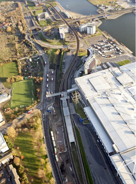 Aerial view of Custom House Station (Crossrail to left, existing DLR to right) looking east towards Connaught Tunnel