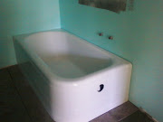 The bathtub is in place with rough in plumbing.