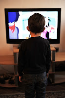 kid watching TV