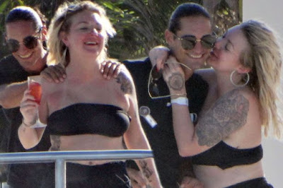 Sheridan Smith cuddles up to a mystery man as she lets her hair down in Mexico; 