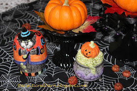 Eclectic Red Barn: Candlesticks with small pumpkins and Halloween salt and pepper shakers