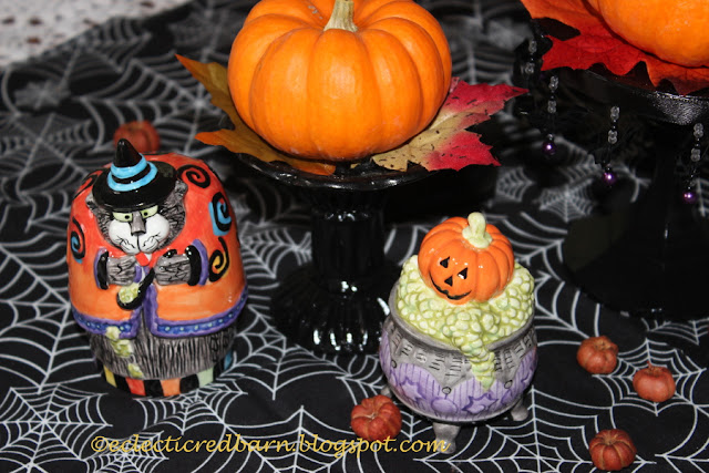 Eclectic Red Barn: Candlesticks with small pumpkins and Halloween salt and pepper shakers