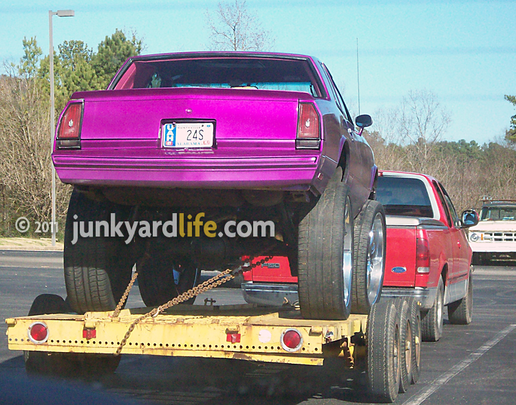 A Chevy Monte Carlo SS on monster dubs looks ready to crush cars on Monster