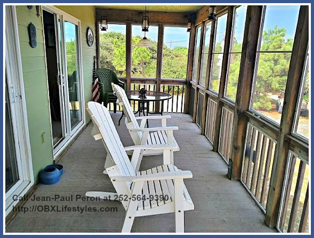 Spend quality time with friends or just enjoy a quiet moment in the screened porch of this beautiful beach home for sale in Outer Banks NC.