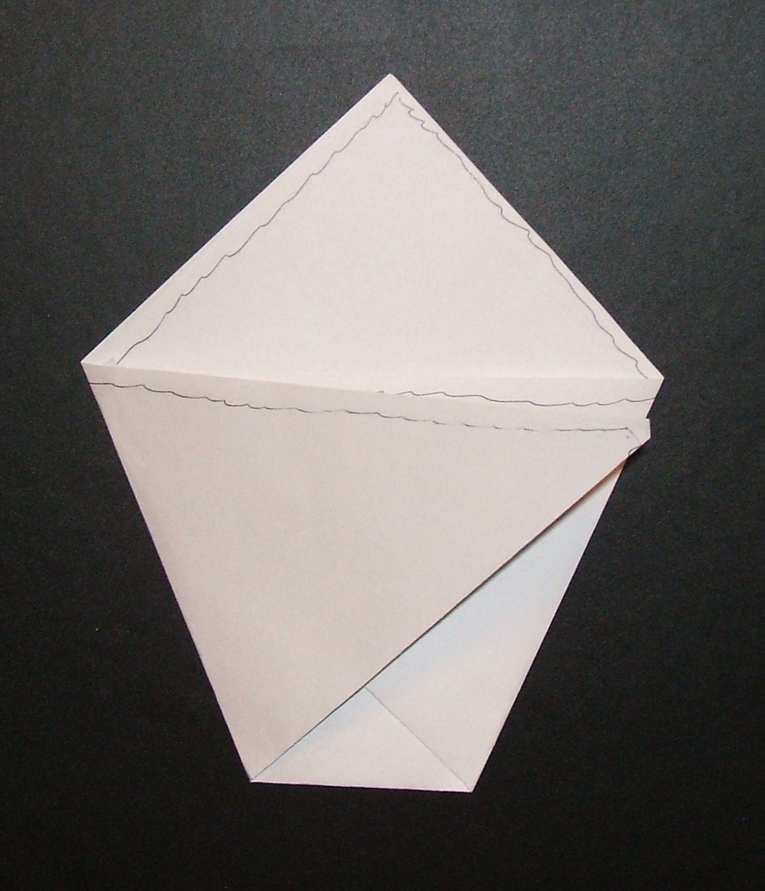 Take the left corner and fold it over until the pointmeets the ...