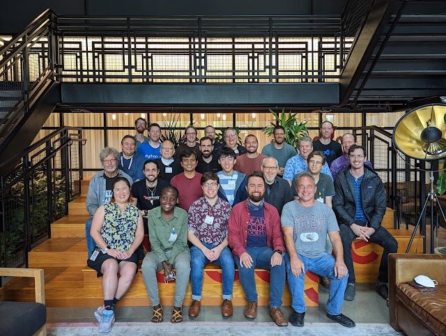 A group photo of the sprint participants with 25 people, mostly smiling