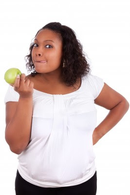 Picture of a woman holding an apple