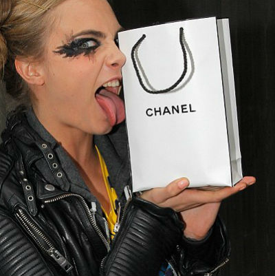 Image of Cara Delvinge with a chanel shopping bag