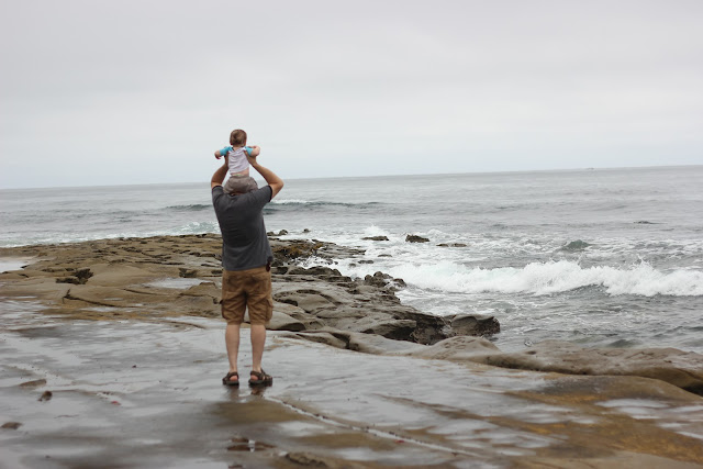 Baby Looking Out At The Ocean