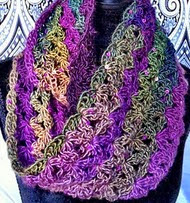 http://translate.google.es/translate?hl=es&sl=en&tl=es&u=http%3A%2F%2Fwww.crochetgeek.com%2F2013%2F04%2Fcrochet-infinity-scarf-aquatic-blossom.html