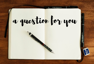 Open book with black cursive writing "a question for you"