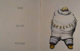 An open book. The lefthand page reads "This Quiet Fellow" and the righthand page shows an illustration of a bulky creature with a small, single-eyed head.