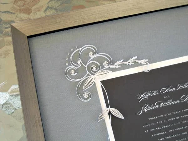 framed wedding invitation with all-white quilled design