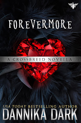 Forevermore book cover, a large ruby heart lying on a bed of black feathers. Silver banner across the middle that says A Crossbreed Novella