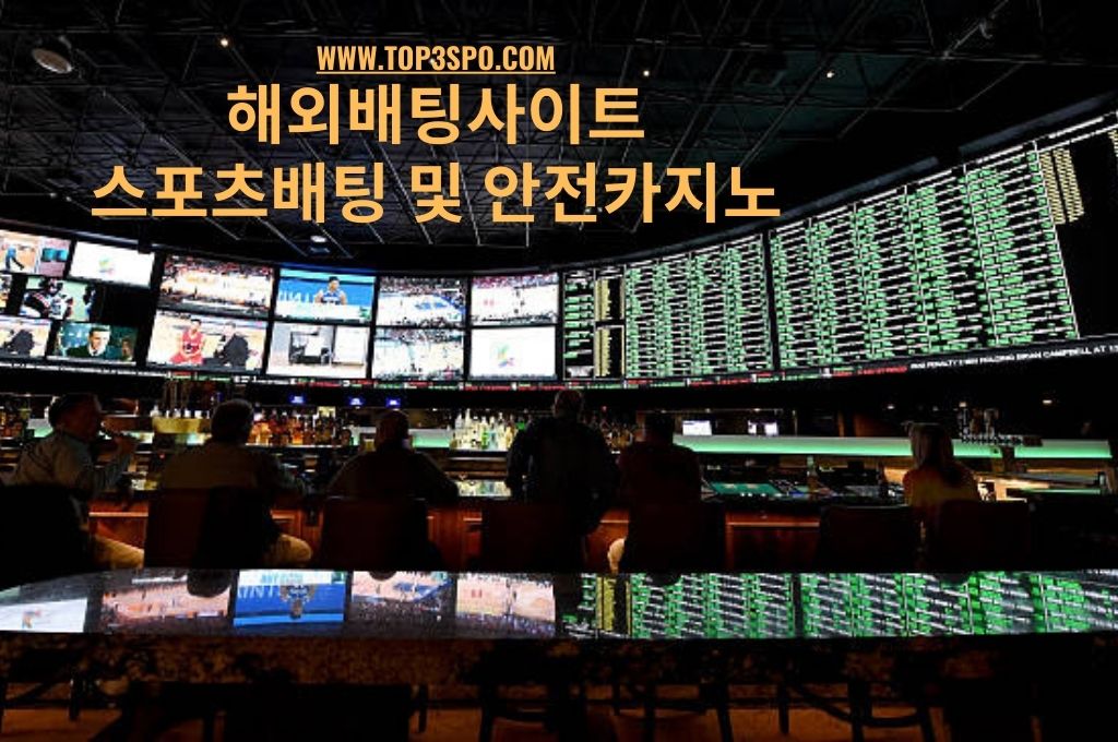 Sports bettor at the West Gate, Las Vegas betting on the horse racing games at the Big  indoor LED video wall