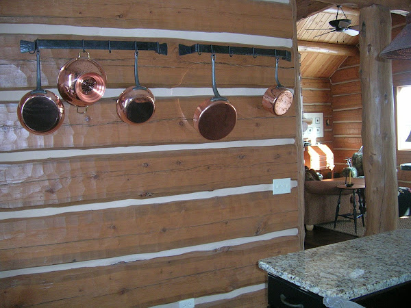 Pot Rack Log Wall in Kitchen