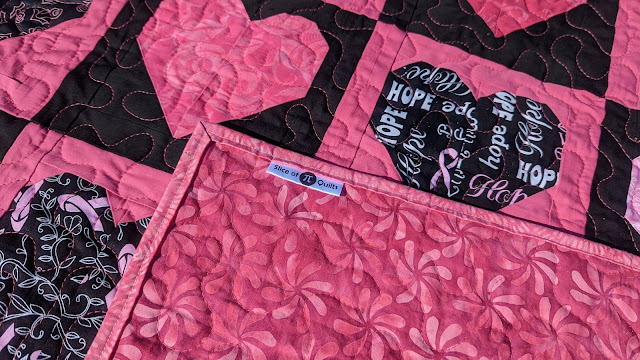 Pink and black heart quilt using breast cancer awareness fabric