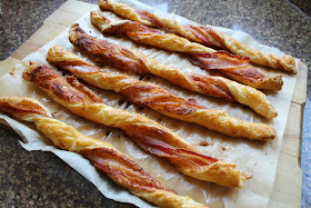 Food Lust People Love: Puff pastry spread with Dijon and sprinkled with Parmesan, then twisted with streaky bacon, is baked till it's crispy, puffed and golden. Bacon Parmesan Twists are a divine savory snack!