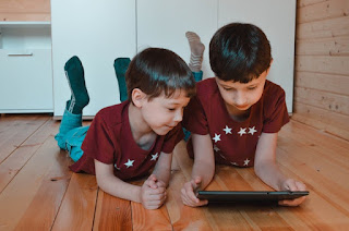 Children watching something on a tablet