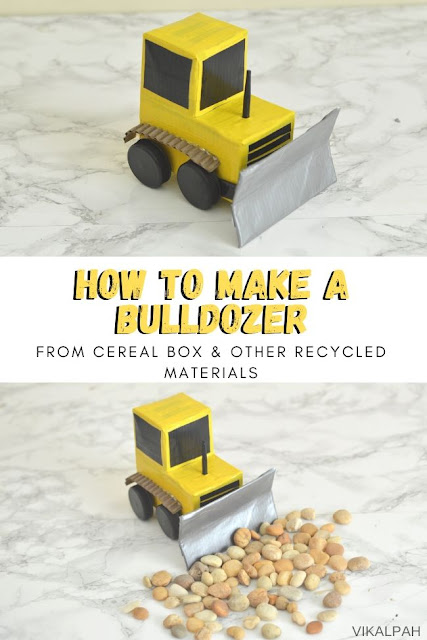 Bulldozer toy made using cereal box and other recycled materials displayed