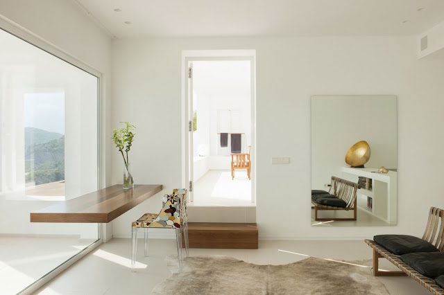 Minimal working room with wooden table 