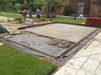 Shuttered area being filled with concrete