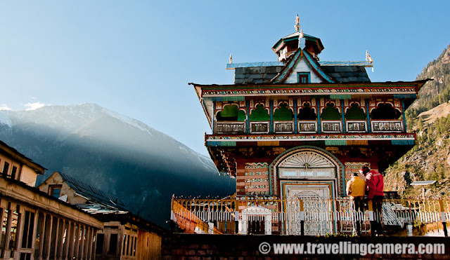 A wonderful place for adventurous campers: Sarahan, Kullu : Vandana Bhagra, Shimla : Hidden among the snow covered hills of Shrikhand Mountian Ranges, which are known for their mythological significance and is said to be one of the adobe of Lord Shiva, this unknown village beckon those with an adventurous spirit as its beautiful landscape and lush green valley will take your breath away. Many of you may get confused with Sarahan in Shimla district with its beautiful Bhimakali Temple but those you know and have been to Kullu will know this Sarahan better at 3200 metres height, and that too if they have had the zeal to walk all the way to picture its magnificent beauty.If you start your journey from Shimla then head towards Narkanda about 63 kms and then towards Nirmand which is another 28 kms approximately, with panoramic views of the Satluj Valley. From there you reach Bhagi Pul and then an uphill narrow road covering a distance of about 12 kms leads to this small village nestled among the mountains in all is pristine. Those who wish to travel by bus should be prepared for a long journey as it is nearly 176 kms from Shimla and can take up to 10 hours to reach, but of course with few stops and immense beauty to admire. Those planning to come from Beas side should be aware that there is no motorable road and would have to cross on foot from the Bishloi Pass.The HPPWD rest house situated outside the village offers decent accommodation which needs to be booked in advance but for the more adventurous laying out their tents (which of course you need to carry) in the open meadows can always be an option. With permission from the Government School nearby you can set your camp under the starry sky. The huge ground in the centre of the village is surrounded by fields, flora and fauna, water streams, waterfalls with amazing views of the snow covered hills nearby.  With so much natural beauty around it becomes quite hard to concentrate on anything and then there were these kids studying in their open air classrooms.Those rring to go can begin their trek from Kullu Sarahan to Bashleo Pass through the dense forests and green meadows to experience this place and its serenity. A one day trek to the nearest snow covered peak is an enjoyable experience as one would come across innumerable waterfalls, small stream and unexplainable natural beauty. The freshness and the virginity of the place suddenly hits you taking you thousands and thousands of miles away from your hustle bustle city life.  Other trekking options include heading towards the Jaon village to begin the Shrikhand trek through various hills, forests and streams. Village folk are often seen walking all the distance to Bangar and making it back by dinner time.The most typical feature about this village is its beautiful temple dedicated to sage Shring and gives a feeling of being a step closer to god and reaching for the sky. The use of vibrant colours, intricate artwork and unique architectural style will capture your imagination. The snow covered hills behind the templegives it a perfect backdrop of picture perfect beauty. The recently concluded two day Jhiru mela held during sangrand in April celebrates the beginning of the New Year which witnesses the village folk in their traditional dresses, dancing and singing to folk songs and wishing for prosperity.In case you plan a trip to Kullu and its better known destination do not forget to enquire about this small little village as it will equally charm you as would the other destinations.Photo credits: VJ Sharma