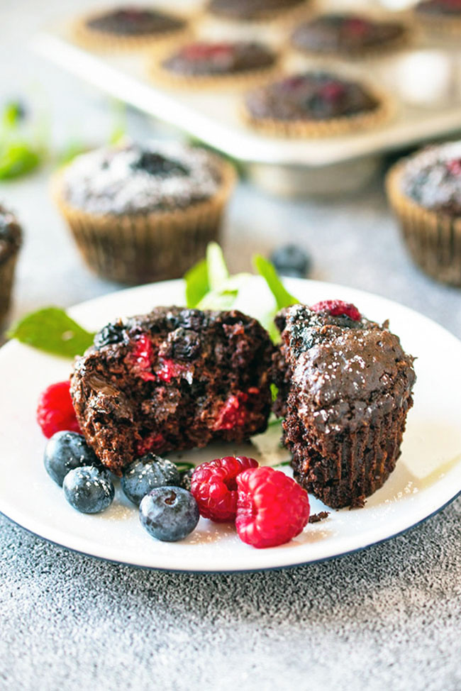 Double Chocolate Berry Muffins (Vegan), cut open with berry filling and melted chocolate chips