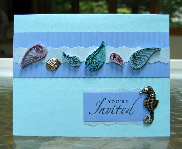 Quilled seashell card with metallic seahorse and shell charms