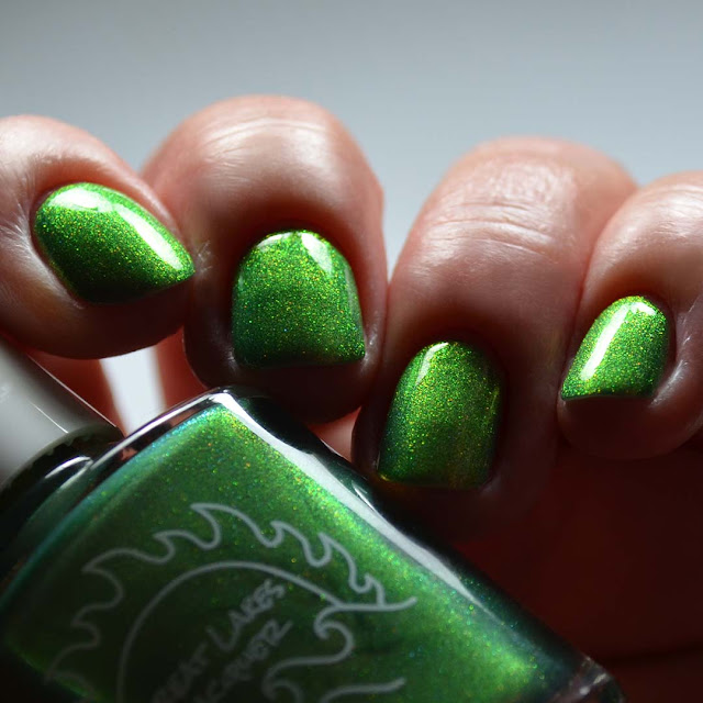 green shimmer nail polish swatch low light