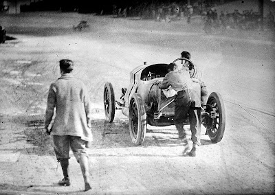 Indianapolis 500 pushing their car towards the finish line