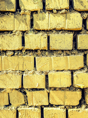 A Minimalist Photo of brick of yellow all in repetition shot by Samsung Galaxy S6 Smart Phone