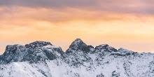 Snowy Mountains and Sunset Sky