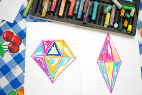 "Painting" with oil pastels to create beautiful "crystal" sun catchers with kids