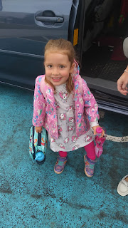 Ellie with her lunch bag and backpack on her first day of school