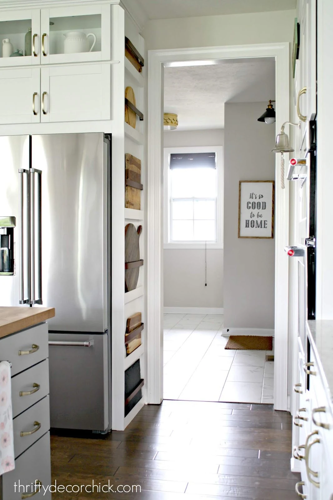 fridge with cutting board storage on side