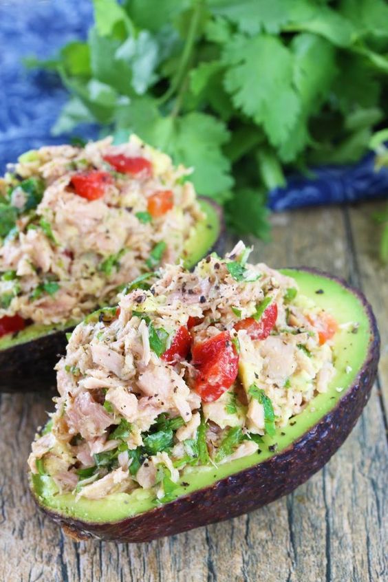 Gluten free Paleo · Serves 2 · This Healthy Tuna Stuffed Avocado is stuffed with a flavorful southwest mixture of tuna, bell pepper, jalapeno, and cilantro. No mayo necessary here! It's the perfect healthy lunch.