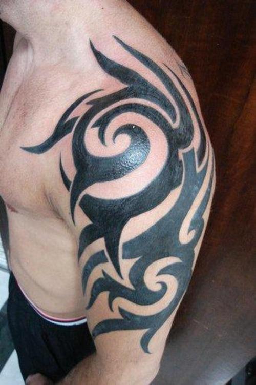 tribal tattoos on shoulder and chest. tribal tattoos chest to arm.